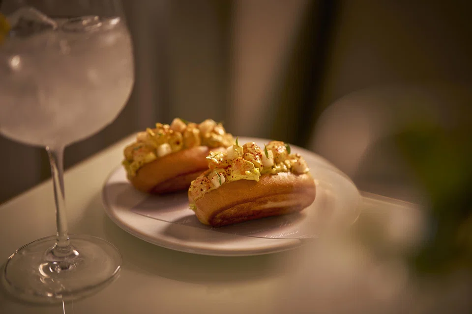 Shrimp in curry mayo dressing on toast.