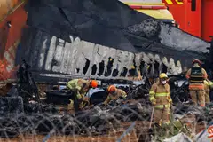 Firefighters inspect the wreckage of Jeju Air Flight 2216 at Muan International Airport in Muan County, South Korea, Dec 30, 2024. 