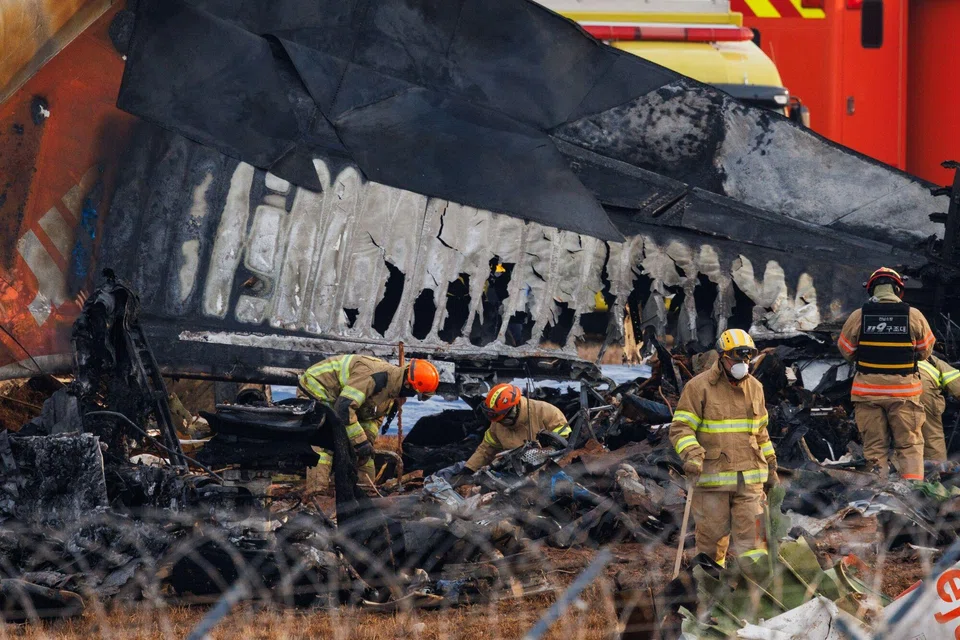 Firefighters inspect the wreckage of Jeju Air Flight 2216 at Muan International Airport in Muan County, South Korea, Dec 30, 2024. 
