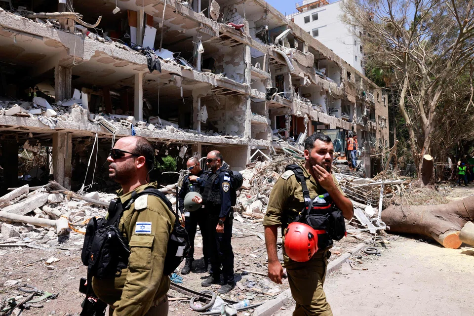 Israeli security forces and first responders gathering in front of a building heavily damaged by an Iranian strike on Tel Aviv. Investors should recognise that a growing range of events has crossed red lines and presage a new regime of elevated geopolitical volatility.