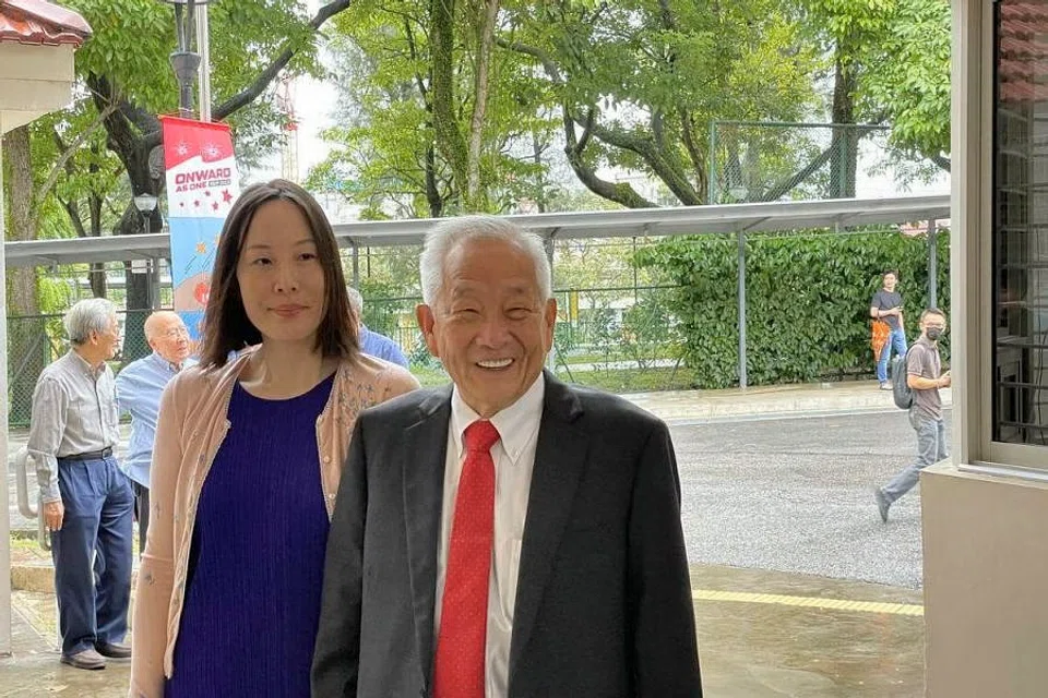 Ng Kok Song and his fiancee Sybil Lau arriving at the Elections Department shortly past 10.30 am on Wednesday to pick up an application form for the certificate of eligibility. 
