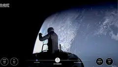 This still image taken from a SpaceX and Polaris broadcast shows US fintech billionaire Jared Isaacman (EV1) peeking out to space from a hatch structure called "Skywalker", during the first private spacewalk performed by the crew of the SpaceX Polaris Dawn mission. 