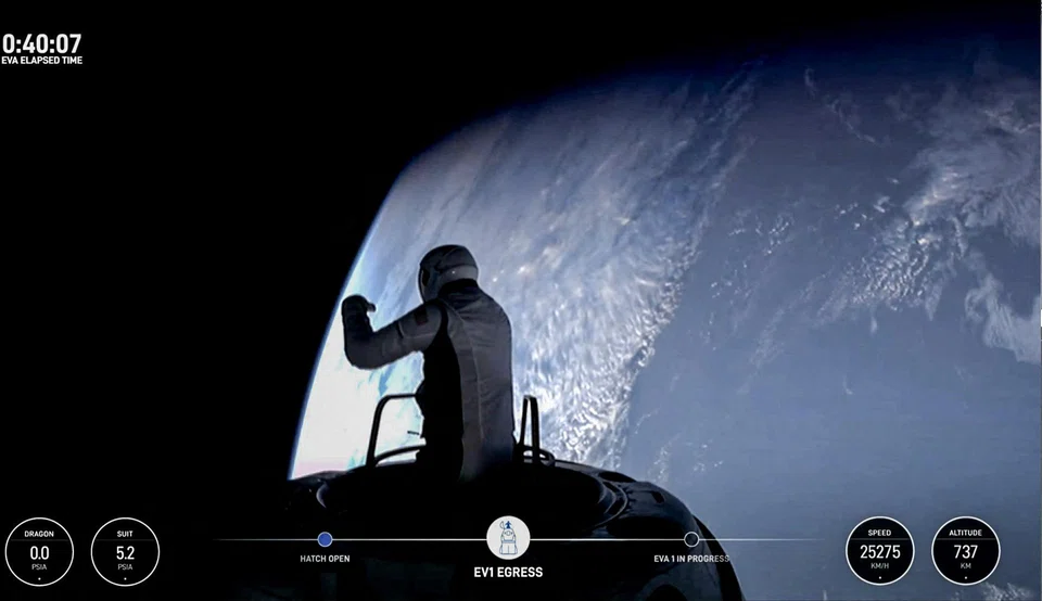 This still image taken from a SpaceX and Polaris broadcast shows US fintech billionaire Jared Isaacman (EV1) peeking out to space from a hatch structure called "Skywalker", during the first private spacewalk performed by the crew of the SpaceX Polaris Dawn mission. 