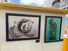 Artworks by Ang Lai Seng, an inmate in Changi Prison, on display at the Yellow Ribbon Community Arts Festival. His works are inspired by religious imagery and Chinese cultural symbols.