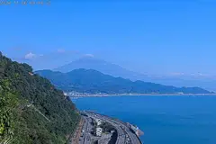 Photographs taken from different points around Japan’s highest mountain where the skies were clearer showed a dusting of snow on its peak.