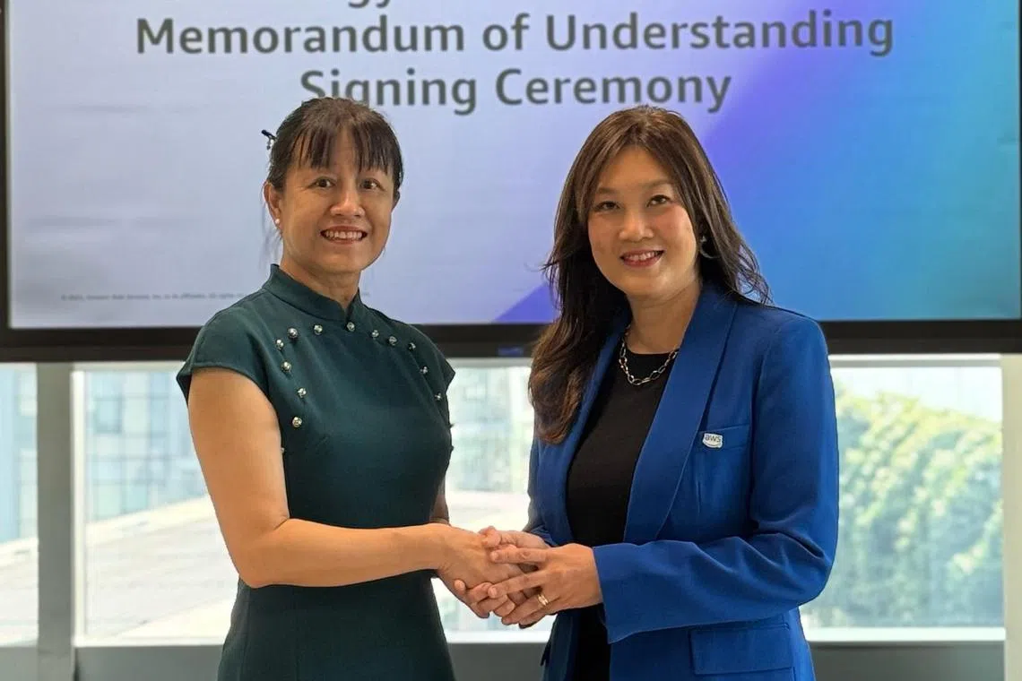 NIE's director, Professor Liu Woon Chia (left), and AWS' worldwide public sector and Singapore country manager, Elsie Tan at the signing of the memorandum of understanding.