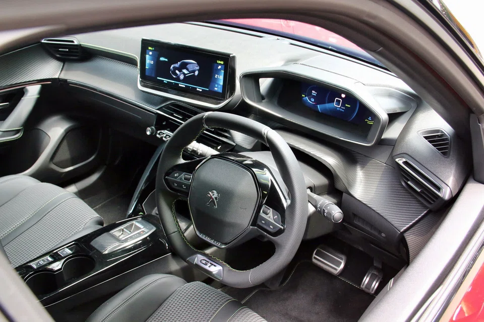 You look over the steering wheel instead of through it, because it’s unusually small and wieldy. 