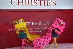 Lion dancers perform in front of guests at the official unveiling of Christie’s new Asia Pacific headquarters at the Henderson Centre in Hong Kong.