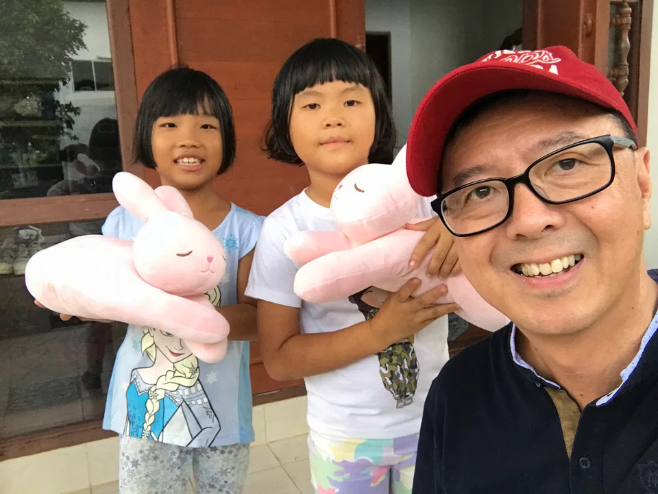 Paul Heng, the writer, with two children at an orphanage in Chiang Mai in 2018.
