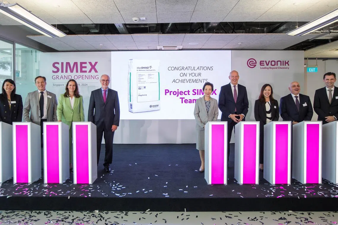 Minister for Sustainability and the Environment Grace Fu (fifth from left) along with Evonik's deputy chairman Harald Schwager (fourth from left) and other officials at the opening of the chemical giant's expanded facility on Jurong Island.