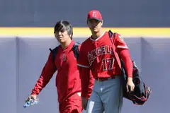 Shohei Ohtani (right) of the Los Angeles Angels arrives with his translator Ippei Mizuhara (left) at Peoria Stadium on Feb 26, 2018 in Peoria, Arizona. Mizuhara was charged with bank fraud on April 11, 2024, for stealing more than US$16 million from Ohtani to pay gambling debts. 