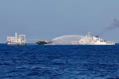 File photo of Chinese Coast Guard vessels firing water cannons towards a Philippine resupply vessel on its way to a resupply mission at Second Thomas Shoal in the South China Sea on Mar 5, 2024. 