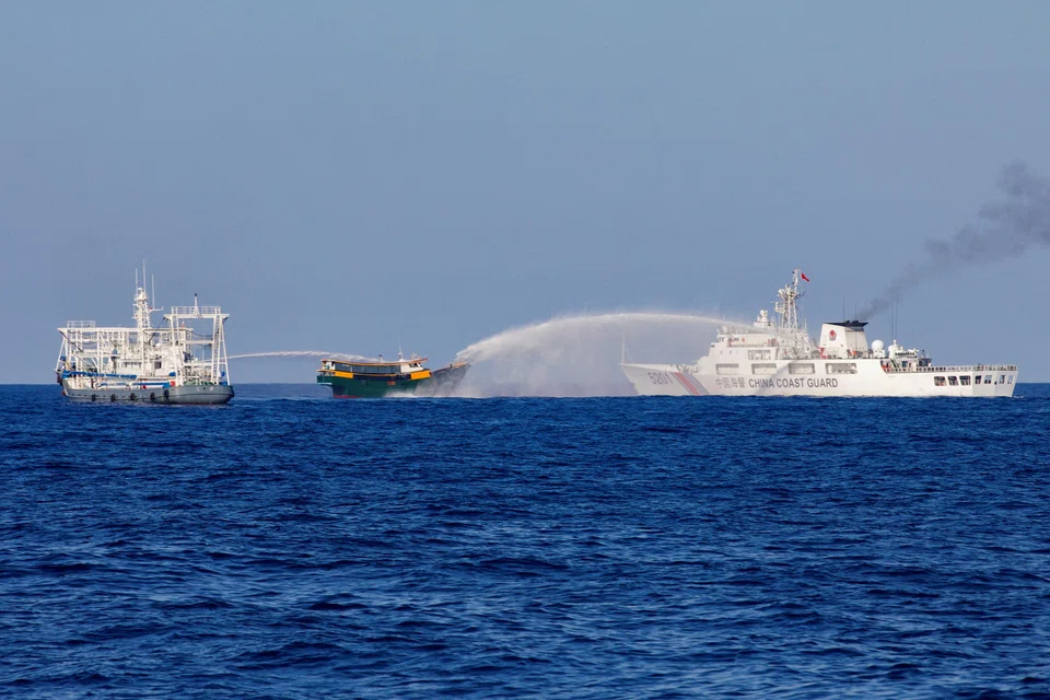 File photo of Chinese Coast Guard vessels firing water cannons towards a Philippine resupply vessel on its way to a resupply mission at Second Thomas Shoal in the South China Sea on Mar 5, 2024. 