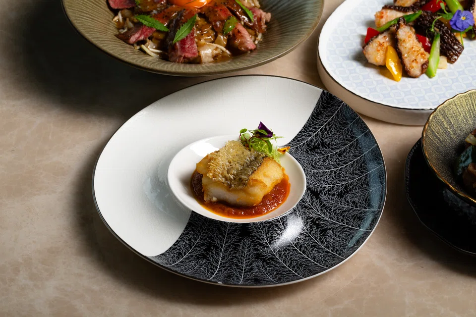 Deep-fried crunchy skinned cod with a spicy sauce.