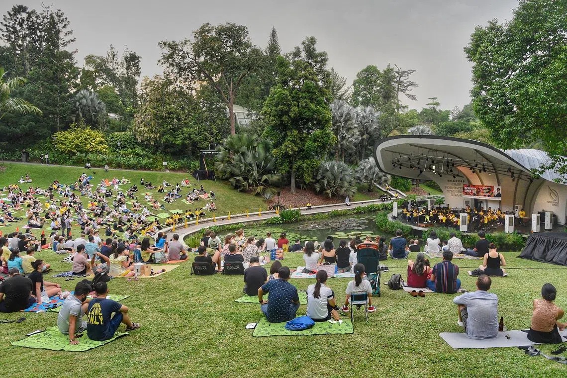 People enjoying a concert at the Singapore Botanic Gardens,  a World Heritage Site. Access to arts and culture plays a part in enlivening the city.