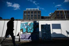 A stretch of the Berlin Wall at the East Side Gallery, Berlin. Many Germans have been generally content with their post-Cold War lot, seeing themselves generally as beneficiaries of globalisation, but this may be changing.