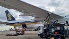 A Singapore Airlines (SIA) plane being refuelled with blended sustainable aviation fuel at Changi Airport, 7 July 2022.