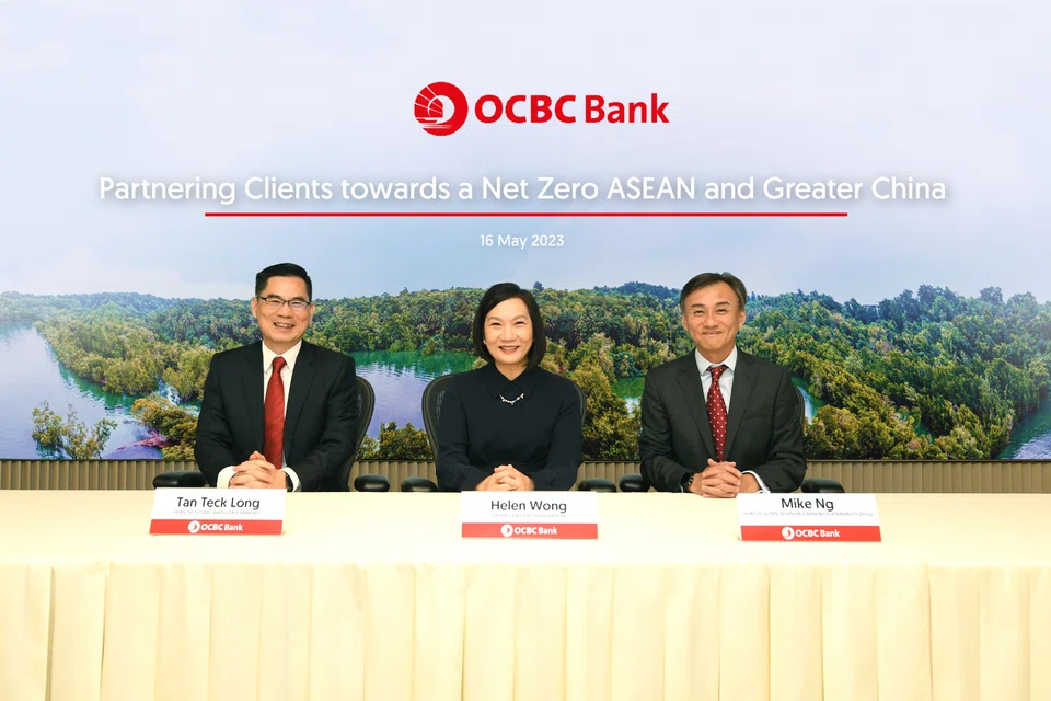 From left: OCBC's head of global wholesale banking Tan Teck Long, chief executive officer Helen Wong, and head of global wholesale banking sustainability office Mike Ng, at the announcement of the bank's decarbonisation targets on Tuesday (May 16).