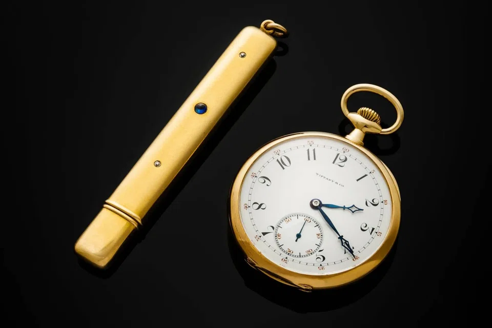 John Jacob Astor IV’s 18K gold Patek Philippe pocket watch, along with his gold pencil case.