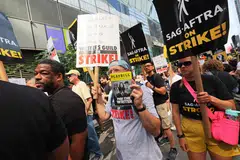 Members of SAG-AFTRA and Writers Guild of America East walk a picket line outside of the HBO and Amazon offices in New York City, Aug 22, 2023. 
