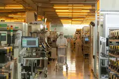 Workers in the clean room for silicon semiconductor wafer manufacture at the Newport Wafer Fab, owned by Nexperia Holding BV, in Newport, UK, August 2022. 