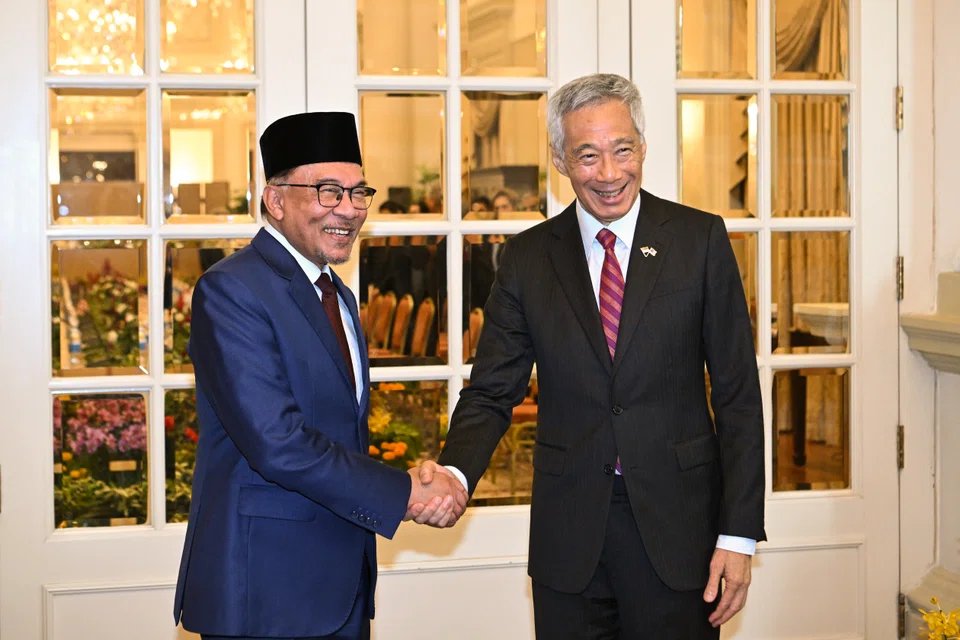 Malaysia Prime Minister Anwar Ibrahim (left) met Prime Minister Lee Hsien Loong at the Istana during his first official visit to Singapore on Jan 30, 2023.