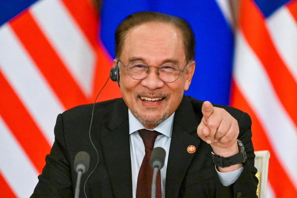 Former prime minister Mahathir Mohamad on Monday urged Prime Minister Anwar Ibrahim  (above) and his Cabinet to resign.
