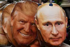 Masks of US President Donald Trump (left) and Russian President Vladimir Putin displayed for sale in Moscow. Trump's threat of new sanctions on Russia was overshadowed by Putin's offer of a meeting.