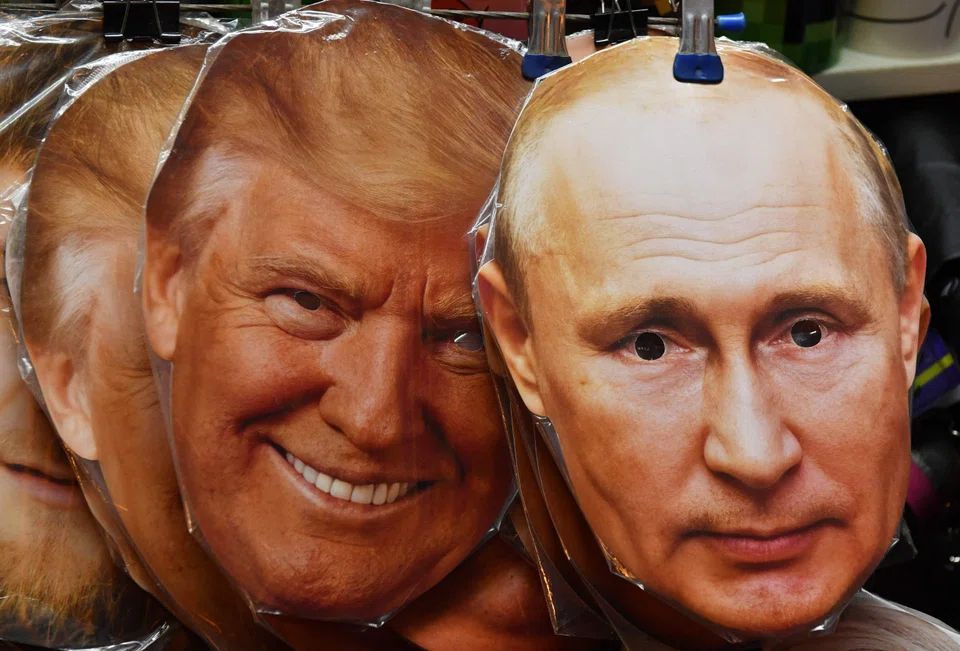 Masks of US President Donald Trump (left) and Russian President Vladimir Putin displayed for sale in Moscow. Trump's threat of new sanctions on Russia was overshadowed by Putin's offer of a meeting.