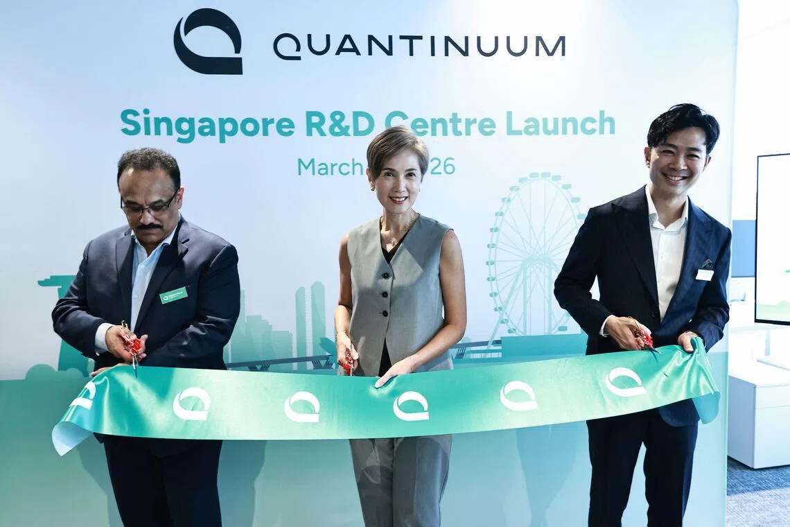 Minister Josephine Teo with Quantinuum’s Dr Rajeeb Hazra (left) and Dr Marvin Lee at the opening ceremony of the company's facility on Wednesday.