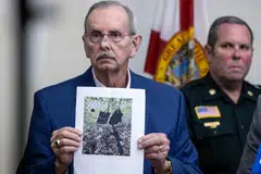 West Palm Beach Sheriff Task Force Contact Sheriff Ric L. Bradshaw shows a picture of an AK-style rifle with a scope, and bags found by the Secret Service at the Trump International Golf Club in in West Palm Beach, Florida, Sept 15, 2024.