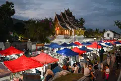 Tourists at a night market in Luang Prabang, Laos. More privatisation deals are expected in the coming months as the government tackles its debt stock burden, say analysts.