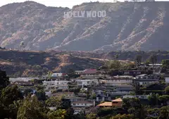 The nearly 60 signatories include comedian Jon Stewart and Oscar-winning actor Joaquin Phoenix.