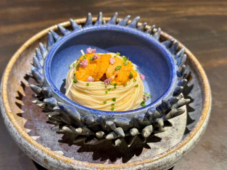 Slippery cold somen tossed in a vinegar dressing with uni.