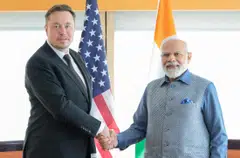 India's Prime Minister Narendra Modi shakes hand with Tesla chief executive Elon Musk during their meeting in New York, US, June 20, 2023. Musk is expected to visit India this month.