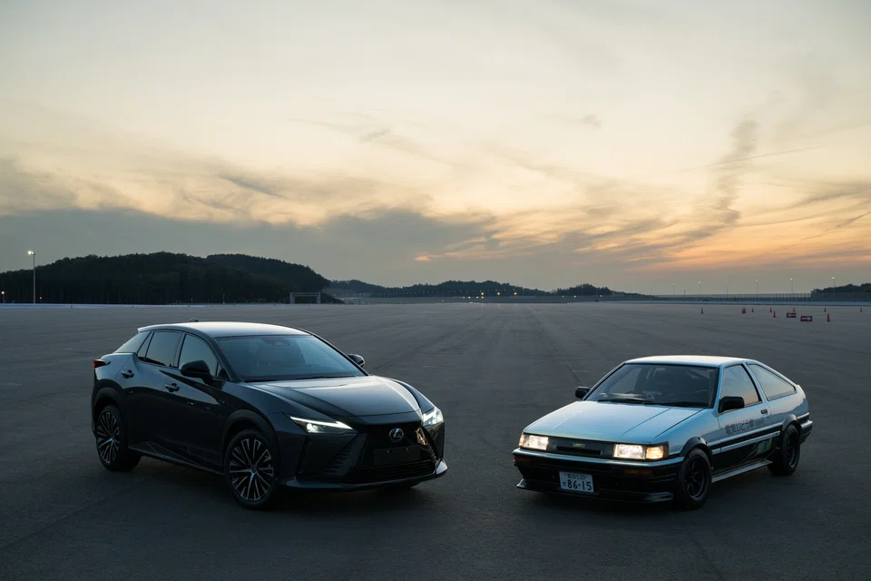 The Lexus RZ (left) electric vehicle with the Toyota AE86 BEV Concept at Toyota's Shimoyama Technical Center.
