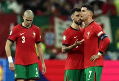 Cristiano Ronaldo of Portugal (right) cries after failing to score a penalty during the match between Portugal and Slovenia in Frankfurt, Germany, July 1, 2024. 