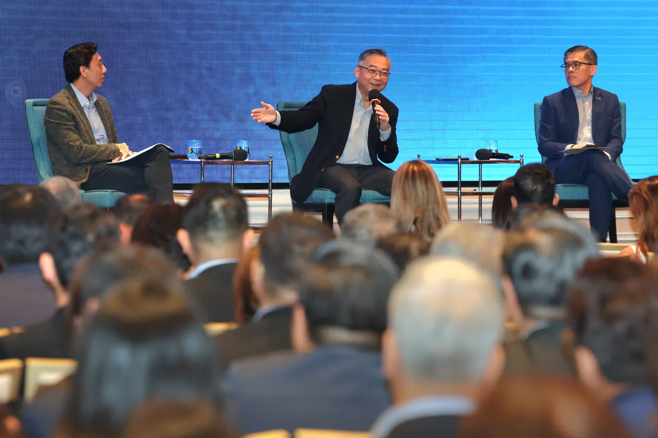 From left: Acting Transport Minister Jeffrey Siow, Deputy Prime Minister Gan Kim Yong and SBF CEO Kok Ping Soon. DPM Gan says he has been reminding Singaporeans they “mustn’t be too happy” about the relatively low tariff rate the country faces.