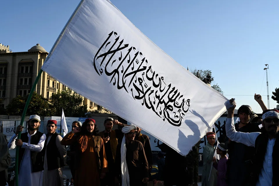 Taliban fighters celebrating the first anniversary of the withdrawal of US-led troops from Afghanistan in Kabul on Aug 31, a day that has been declared a national holiday in the country following the withdrawal of US-led troops from there after a brutal 20-year war. 