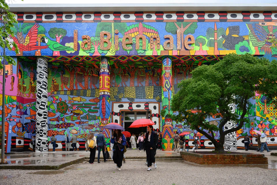 The facade of the Central Pavilion in the Giardini della Bienale, covered in a mural by the Brazilian collective Mahku, during preview week of the 60th Venice Biennale in Venice, Italy, April 17, 2024. 