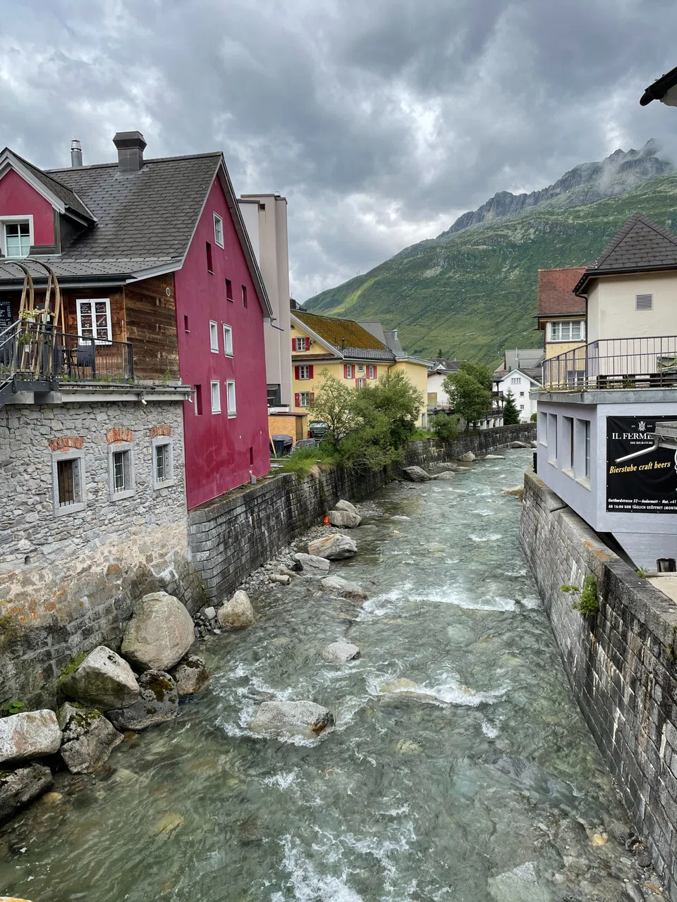 A river runs through Andermatt town.