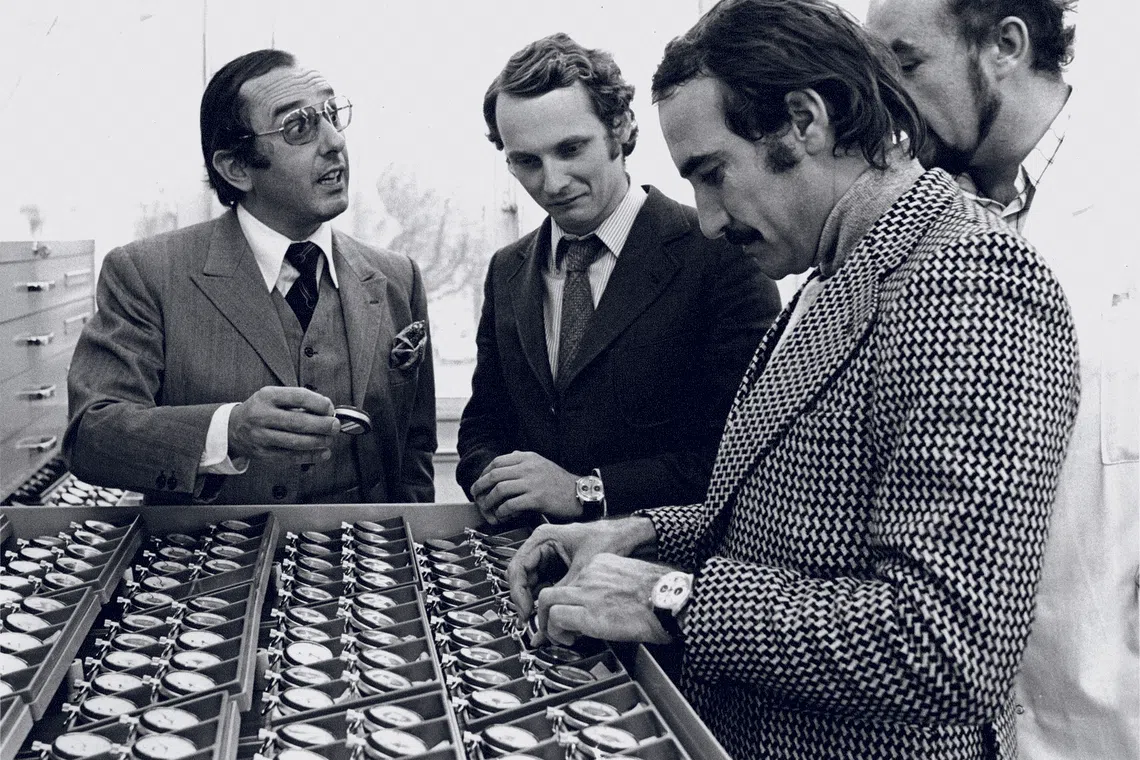 An archival photo of Jack Heuer (left) with F1 drivers Nicky Lauda (right) and Clay Reggazoni (middle) from the 1970s.