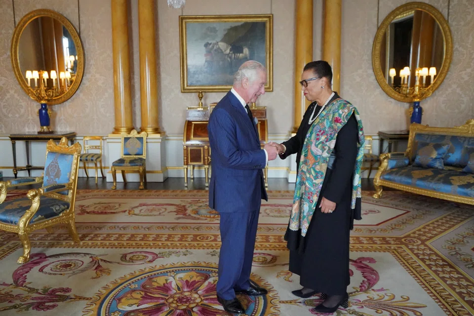 Britain's King Charles handshakes with the Commonwealth Secretary-General Baroness Patricia Scotland at Buckingham Palace, following the death of Britain's Queen Elizabeth, in London, Sept 11, 2022. 
