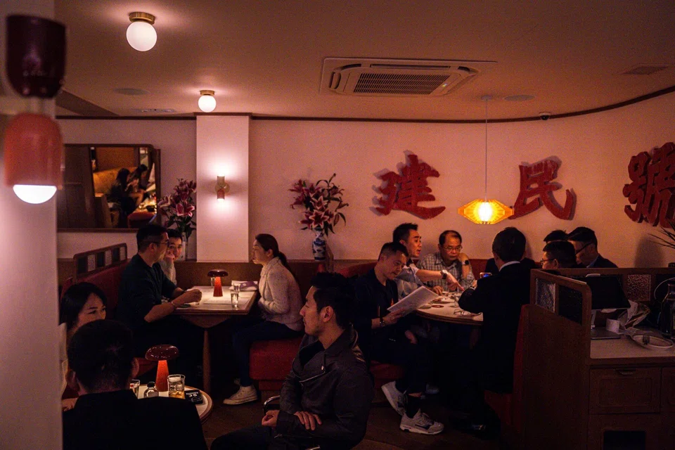 Customers at the Kinsman bar, Hong Kong's first Cantonese-focused cocktail den, which aims to introduce locals and thirsty tourists alike to traditional tastes before they are lost to history. 