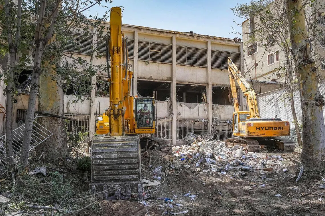 Excavators clearing rubble outside the Evin prison complex in Teheran that was hit by an Israeli strike a few days ago. 
