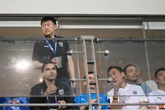 Tech billionaire Forrest Li (standing) watching the Lion City Sailors at Jalan Besar Stadium. on Mar 12. 