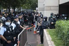 Hundreds of people had queued from the early hours outside the court for the sentencing of 45 Hong Kong pro-democracy activists.