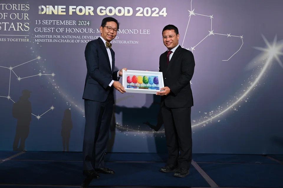 John Lim (left), chairman of CAS, with Minister for National Development and Minister-in-Charge of Social Services Integration Desmond Lee at Dine for Good 2024.