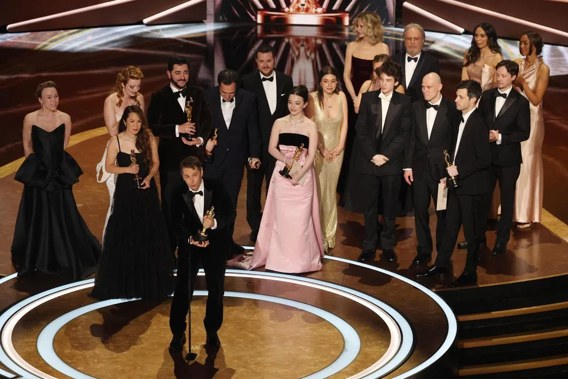 Director Sean Baker accepts the Oscar for Best Picture for "Anora" as producers Samantha Quan, Alex Coco, and Best Actress in a Leading Role winner Mikey Madison look on at the 97th Academy Awards in Los Angeles, California, March 2, 2025. 