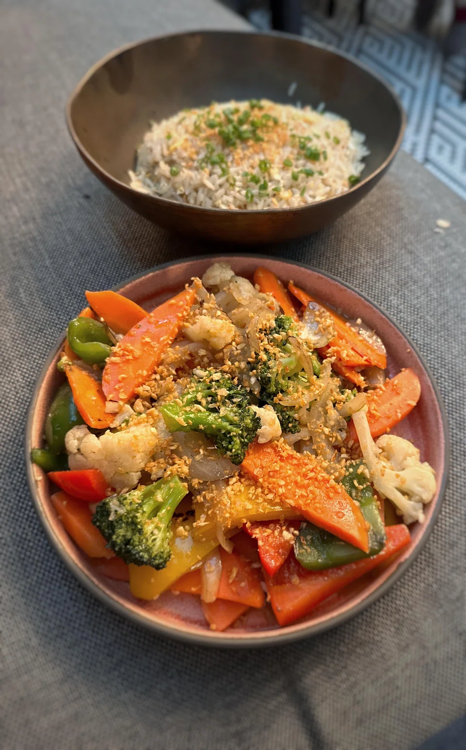 Side dishes include garlic fried rice and stir-fried vegetables.